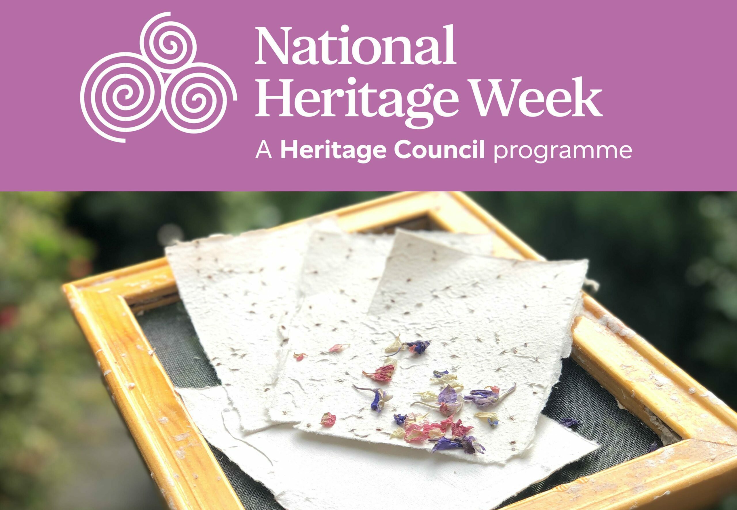 National Heritage Week logo with image of home made paper in the library garden