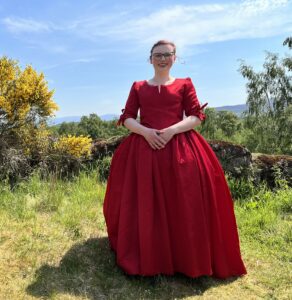 Photo of woman in 18th century dress outdoors