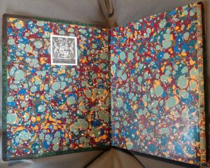 Opening of a book showing marbled endpapers