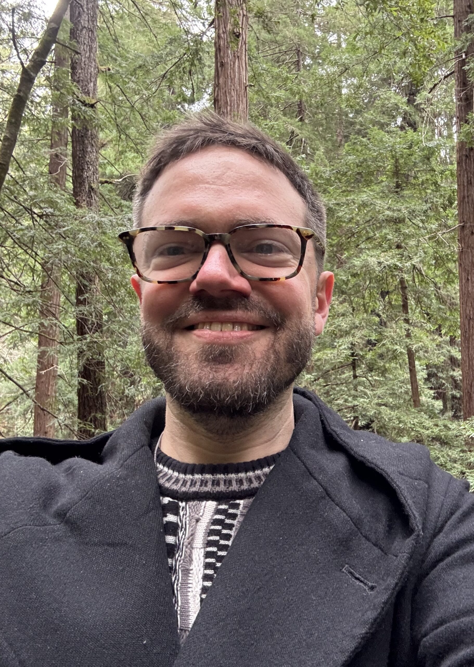 Headshot of a man in a forest